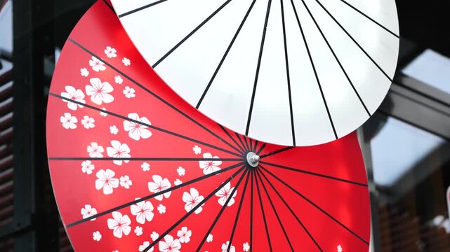 Japanese wagasa decoration displaying red and white with sakura cherry blossom pattern
