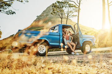 Couple, happy and connection in pickup truck with hug, relax and love bonding for holiday road...