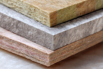 Textured layers of colorful felt sheets stacked together, showcasing various shades and materials, ideal for crafting, design projects, and artistic applications with vibrant colors