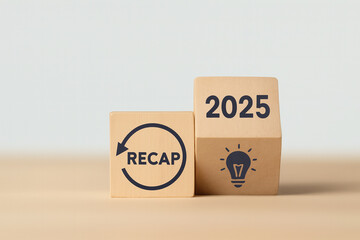 2025 year recap economy, business, financial concept. Business idea planning in 2026. RECAP text on wooden blocks  flipping of 2025 to strategic planning and idea icon on wooden blocks