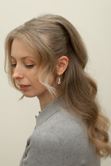 Calm Woman with Elegant Hairstyle Looking Down © Ирина Санжаровская