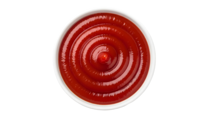A bowl of red sauce on a black background