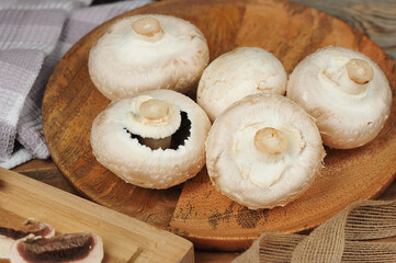 whole mushrooms on a wooden background