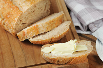 butter and bread sandwich on a wooden