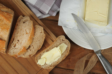 butter and bread sandwich on a wooden