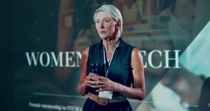 Speaker, stage and conference with business woman for discussion, gender equality and tech workshop. Presenter, feminism seminar and inclusion expo with mature person in convention for summit