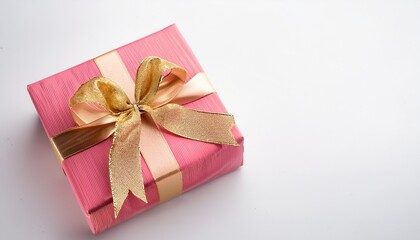 Obraz premium Luxurious Pink Gift Box With Beautiful Goldden Ribbon On White Background