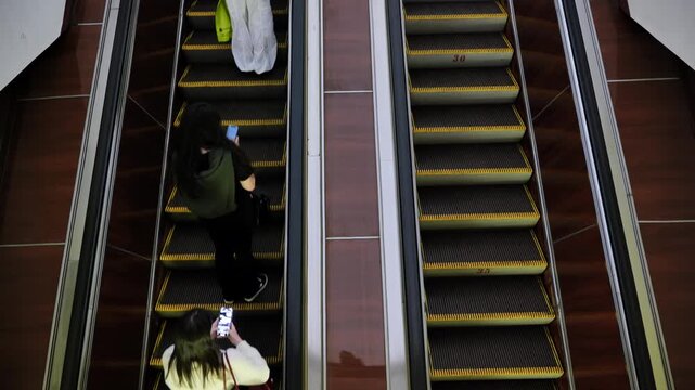 Moscow metro passengers riding escalator, daily commuting in urban setting