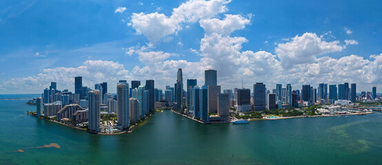 Obraz premium Panorama of Miami skyline. Panorama cityscape of Brickell Miami. Scenic drone view of Florida coastline. Miami skyline with skyscrapers. Aerial view of Miami in summer.