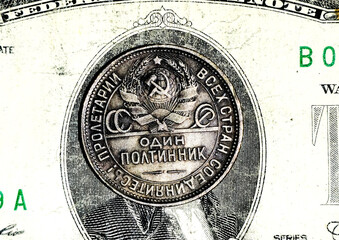 Soviet silver coin &ldquo;One Poltinnik&rdquo; placed on a US dollar bill. Strong conceptual image representing economic contrast, Cold War rivalry, monetary systems, financial power, and historical confrontation