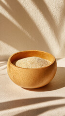 Wooden Bowl Filled with Grain on Soft Beige Surface