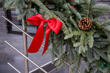 Christmas Fir Garland with Red Ribbon and Pine Cone - Festive Holiday Decoration