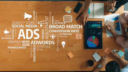 A dynamic workspace scene featuring professionals analyzing advertising strategies, focusing on metrics like conversion rates and quality scores while collaborating on marketing insights. Amity