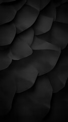Textured black surface with layered shapes creating depth and dimension in a close-up view