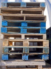Stack of wood pallets some painted blue