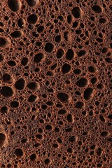 Obraz premium Close-up of chocolate sponge cake texture for baking design and background