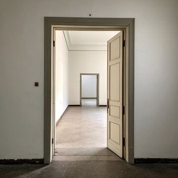 The door that opens to nowhere, standing in silence, symbolizing mystery, uncertainty, the unknown, existential reflection, illusion, and forgotten paths.