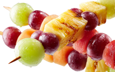 Delicious colorful fruit skewers highlighting fresh grapes melon and pineapple in playful and inviting arrangement isolated on transparent background PNG