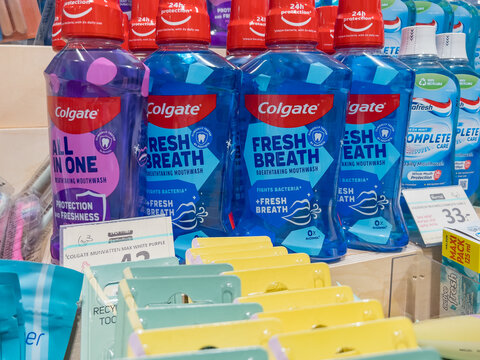 Karlstad, Sweden - October 19, 2025: Colgate mouthwash bottles displayed on a retail shelf, showcasing vibrant packaging and various flavors, ideal for fresh breath and oral hygiene