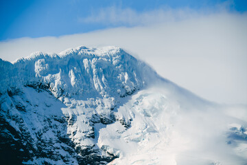 Antarctica Beautiful Mountain Peak Snow Covered Clouds Rolling in. Nature Adventure Travel Climate...
