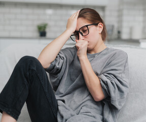 Young Girl Feels Bad At Home With A Headache And Cough