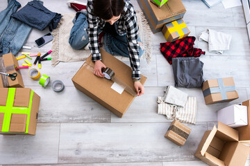 Girl Packs Cardboard Boxes And Takes Photos, Preparing Packages For Shipping