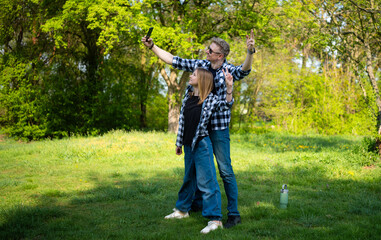 Happy Father And Daughter Taking A Selfie Showing A Victory Sign
