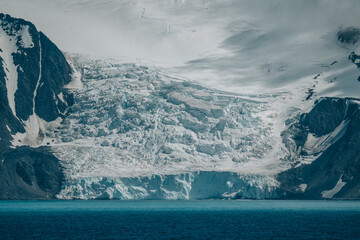 Antarctica Epic Glacier Fine Art Landscape Photography Elephant Island View from Ship. Mountains Ocean Snow Covered. Untouched Nature. © And They Travel