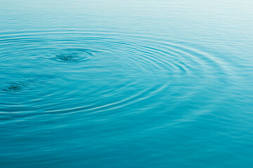 High-resolution water surface background, crystal-clear blue water, gentle ripples, soft natural...