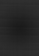 Dark scanned paper texture with visible fold lines and subtle surface grain. Paper scan texture.