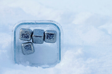 close up of stainless steel ice cubes