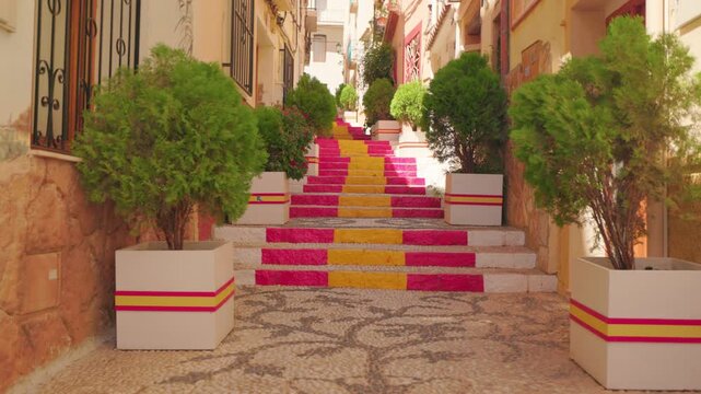 Colorful staircase on narrow Spanish street in Calpe old town