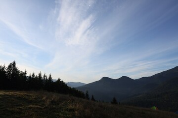 Picturesque view of blue sky with clouds over mountain landscape