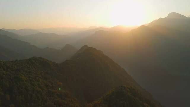 Scenic mountain and lake landscape at sunset viewed from Grande Panchina, Capovalle, Italy, vertical video