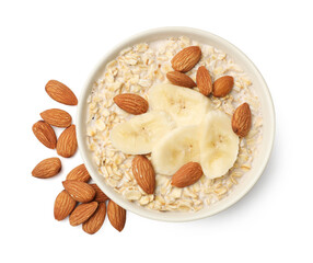 Fototapeta premium Tasty oatmeal with almond milk, nuts and banana isolated on white, top view
