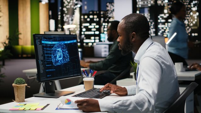 Black man analyst uses AI neural networks for data mining and optimization, working in a multinational company with automation tools. Artificial intelligence digital tools for success. - Powered by Adobe