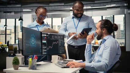 Teamworking traders in prop firm office leverage AI tech to interpret charts, optimizing buying and selling. Brokerage coworkers doing brainstorming, using deep learning to maximize profits