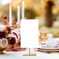 Elegant table sign mockup on gold stand on a luxury decorated outdoor festive table