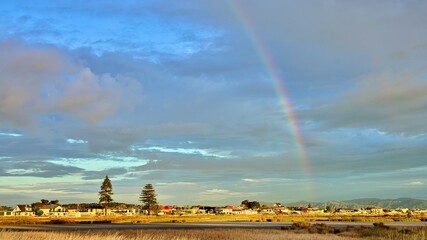 Manawatu Estuary at low tide with a wonderful evening rainbow in the sky.