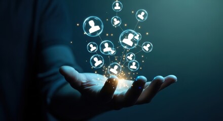 Hand holding glowing digital network connections with people icons against a dark background.