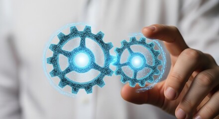 Close up of a hand holding and connecting two glowing digital gears. Technology concept.