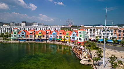 Fototapeta premium Aerial view of Grand World on Phu Quoc Island, Vietnam. Sunny day, colorful buildings, urban resort landscape, and popular travel destination.