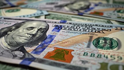 Closeup view of numerous crisp one hundred dollar bills featuring Benjamin Franklins portrait meticulously spread across a surface symbolizing wealth financial prosperity investment and the global ec. - Powered by Adobe