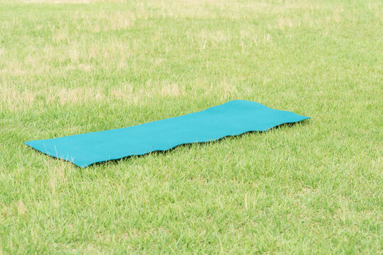 Yoga mat on the grass