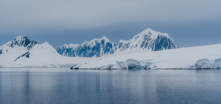 Neumayer Channel Antarctica Palmer Archipelago Dramatic Cliffs Snow Covered Mountains Calm Ocean. Beautiful Natural Landscape Remote Destination