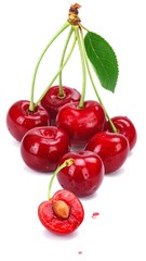 Bunch of glossy, deep red cherries on white, some sliced, stem and leaf visible, with drops of water