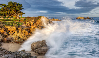 Crashing waves against rocks in Pacific Grove