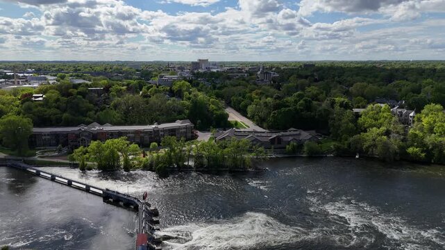 Aerial of Appleton Wisconsin on sunny Summer Day.  Shot on DJI Mini 4 Pro. View of Fox River with Downtown on the Horizon.