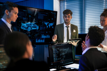 Automotive executives discussing electric car market strategy. Business leadership team analyzing vehicle sales data and future design trends in modern night office.