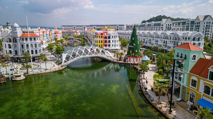 Obraz premium Aerial view of Grand World on Phu Quoc Island, Vietnam. Sunny day, colorful buildings, urban resort landscape, and popular travel destination.